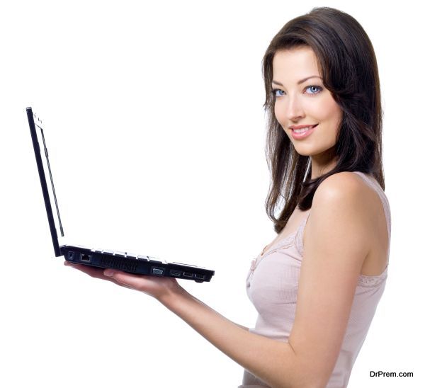 Beautiful woman holding laptop